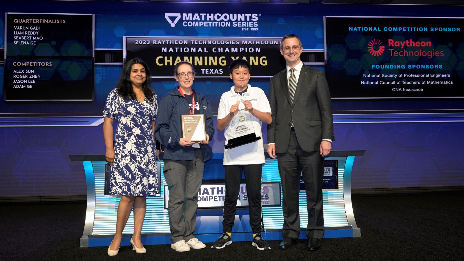The 2023 National Champion, Channing Yang, poses with his coach and representatives from MATHCOUNTS sponsors.